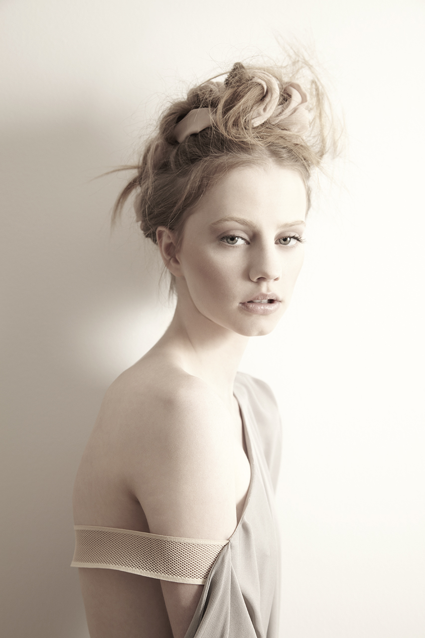 Ethereal Beauty 2 Elegant portrait of a woman with a neutral expression, featuring soft lighting and muted tones, by Liäns Jadän.