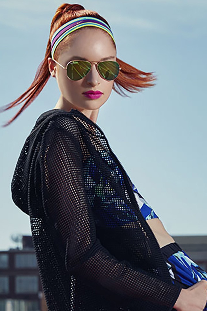 Track Vibes 3 Close-up portrait of a model in vibrant fashion, posing on a track, titled 'Track Vibes' by Liäns Jadän.
